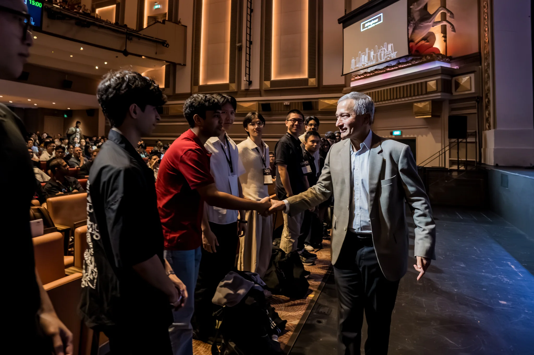 Shreyansh meeting a speaker at the AIE conference.